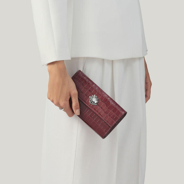 Giovanni Raspini portafoglio continental jungle pelle croco borgogna Portafoglio in pelle e decoro in bronzobianco L0033